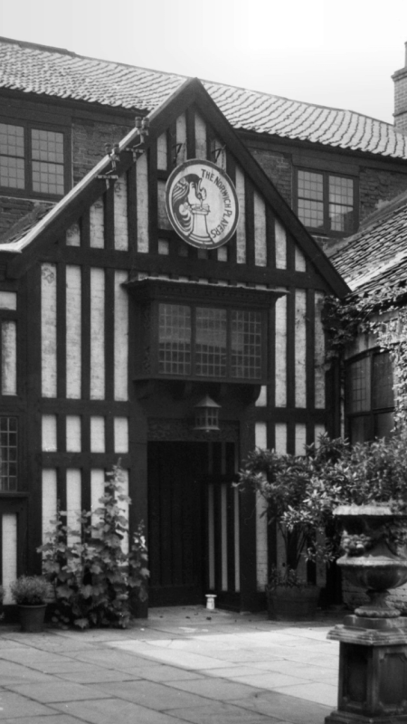 Norwich's Maddermarket Theatre, a black-and-white timbered building in an ancient courtyard